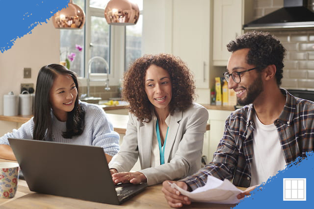 Interracial couple making an offer on a home with the help of a female agent