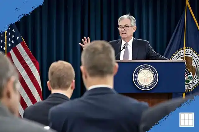 Federal Reserve Chair delivering a speech on the rate decision, May 7, 2025, at a press conference. The American flag and Federal Reserve seal are visible in the background
