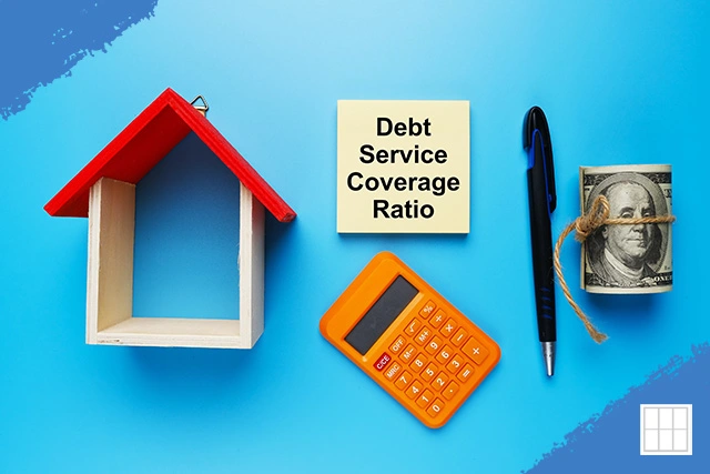 Image of a house model, calculator, pen, and money with a note saying "Debt Service Coverage Ratio" for Kansas City DSCR loans