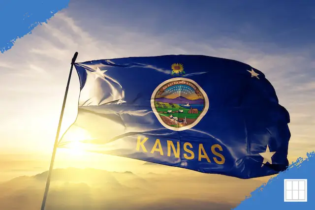 Kansas state flag waving at sunset with mountains in the background, representing pride in Kansas living and the welcoming spirit of Overland Park neighborhoods.