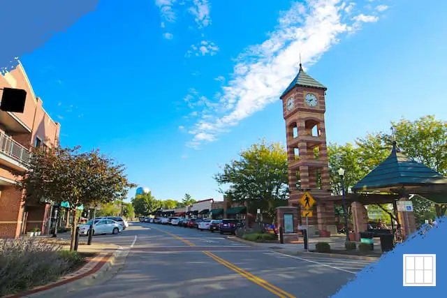 Downtown Overland Park clock tower along a shopping district on a sunny day