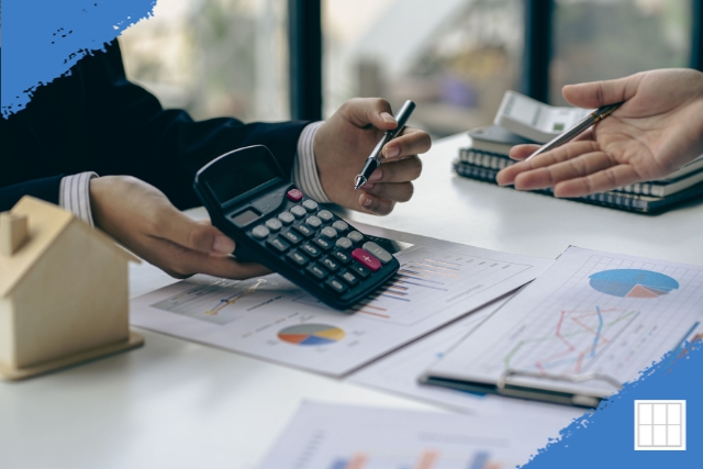 A mortgage advisor reviewing loan documents and financial charts with a client, representing a personalized consultation in Overland Park.