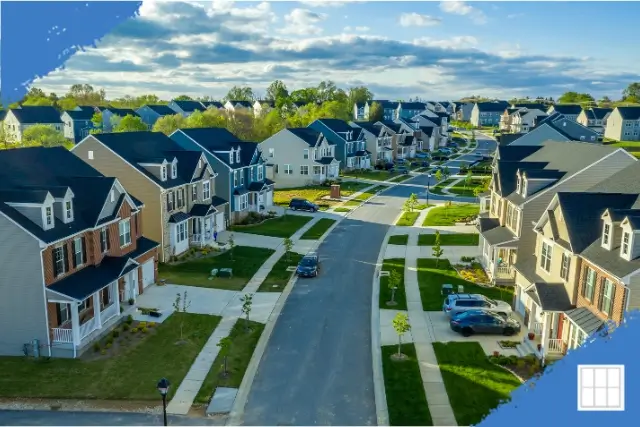 Affordable new construction subdivision in the Kansas City metro area with rows of modern starter homes and manicured lawns, ideal for first-time home buyers.